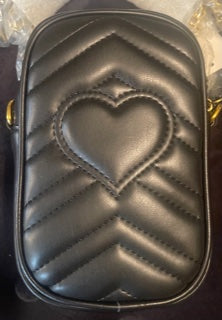 Quilted heart stitched crossbody bag.